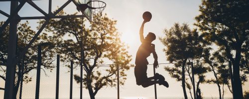 black-man-doing-sports-playing-basketball-sunrise-jumping-silhouette (1)